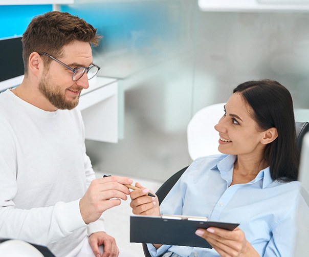 Dentist discussing the cost of a root canal treatment in Tyler 