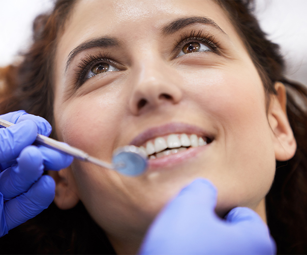 Woman receiving first dental exam at Southern Oaks Dental