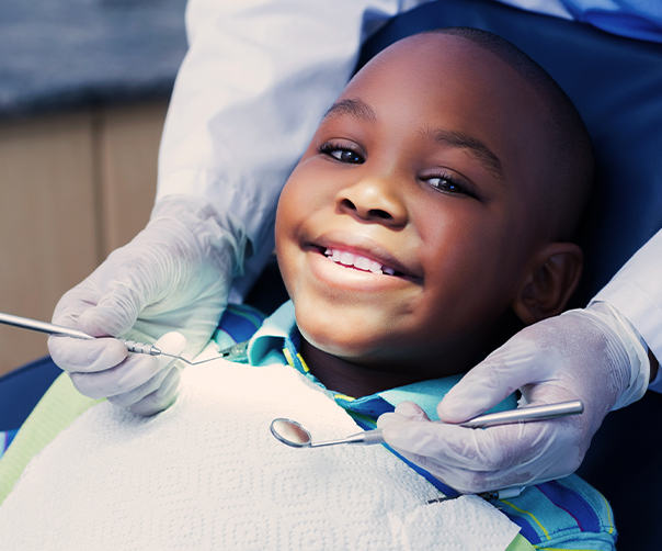 Child receiving dental checkup