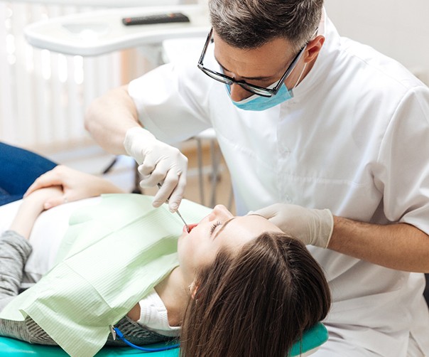 Dentist conducting dental checkup