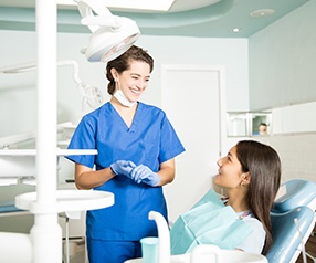 Patient in Tyler  talking to dentist about dental crowns