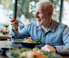 Man eating a chicken salad