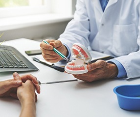 A patient consulting their dentist about dentures’ cost