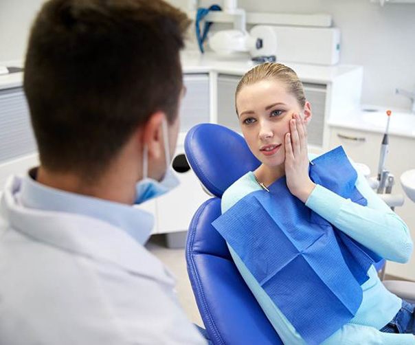 Woman visiting an emergency dentist in Tyler for care