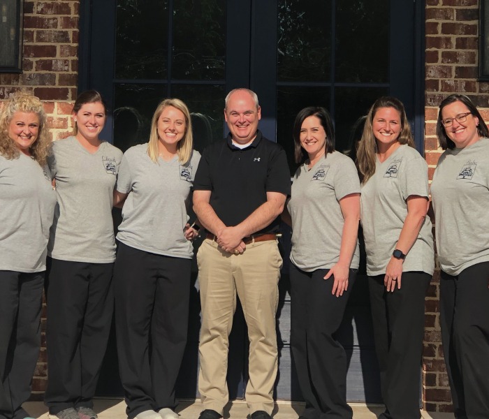 Tyler Dentist and dental team members standing outside of dental office