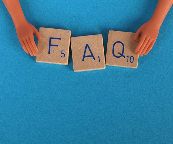FAQ wooden tiles on blue background