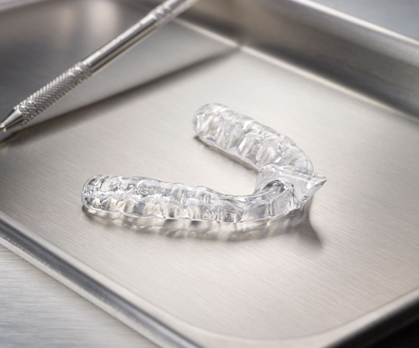 Clear nightguard for bruxism on metal tray