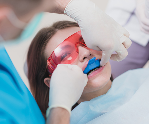 Woman receiving fluoride treatment