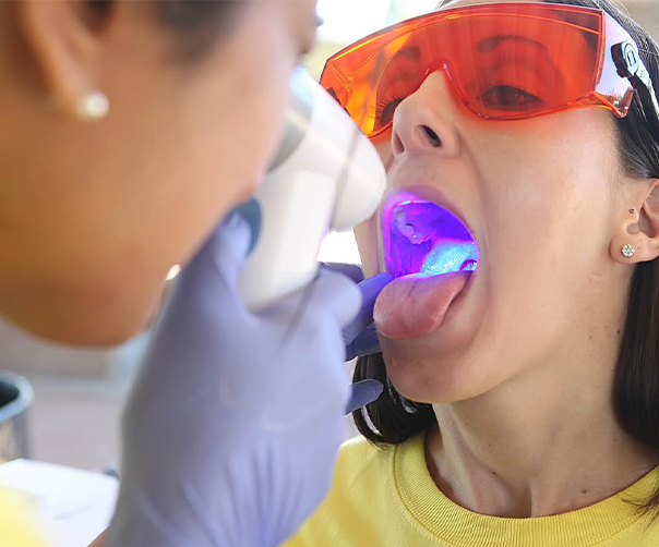 Patient receiving oral cancer screening