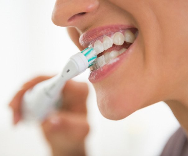 Woman brushing her teeth