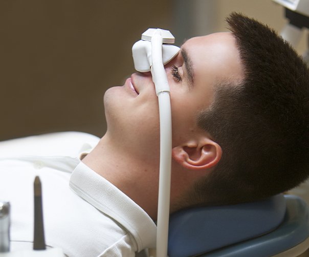 Man with nitrous oxide sedation dentistry nasal mask