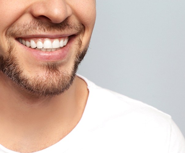 Closeup of man smiling with straight, white teeth