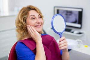 woman wearing dentures in Tyler