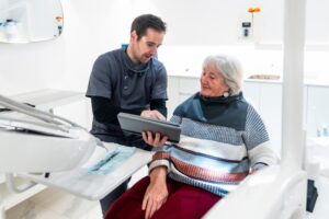 Dentist consulting with patient.